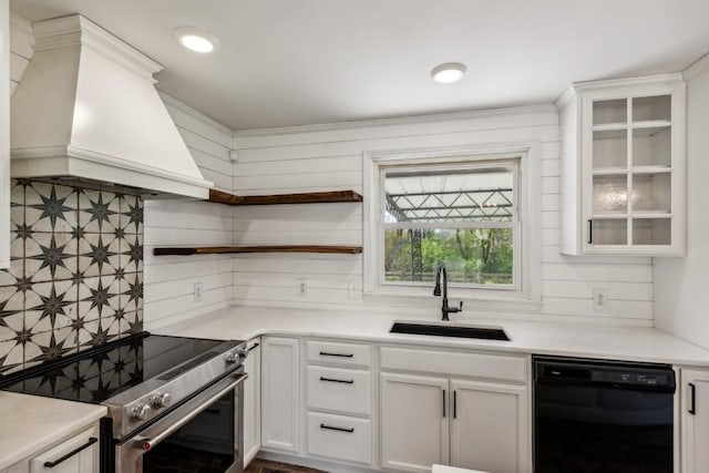 kitchen with dishwasher, white cabinets, high end stainless steel range, and sink