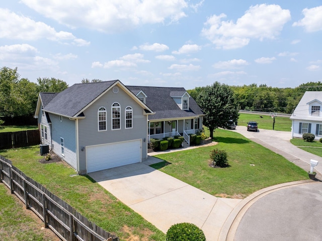 view of front of home with a front lawn, central AC unit, a porch, and a garage