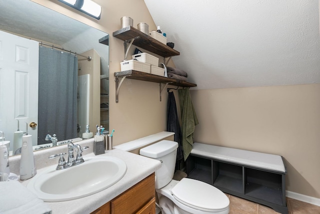 full bath with curtained shower, toilet, vanity, vaulted ceiling, and tile patterned floors