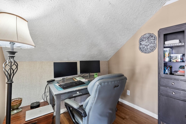 home office featuring dark wood finished floors, a textured ceiling, and baseboards