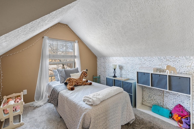 carpeted bedroom featuring vaulted ceiling, a textured ceiling, baseboards, and wallpapered walls