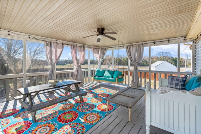 sunroom / solarium with ceiling fan