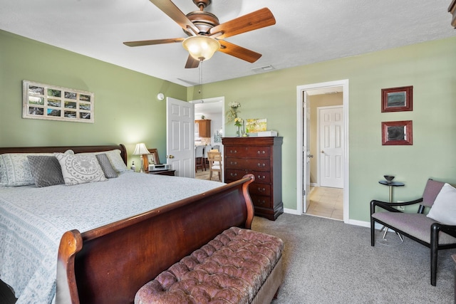 bedroom featuring ceiling fan, carpet, visible vents, and baseboards