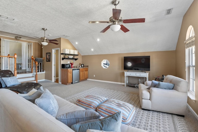 living area featuring light carpet, baseboards, visible vents, vaulted ceiling, and a textured ceiling