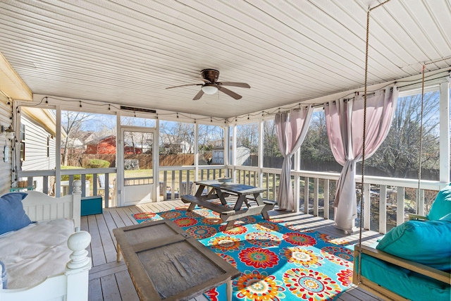 sunroom with a ceiling fan