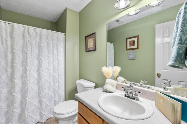 full bathroom with a textured ceiling, toilet, vanity, a shower with curtain, and tile patterned floors