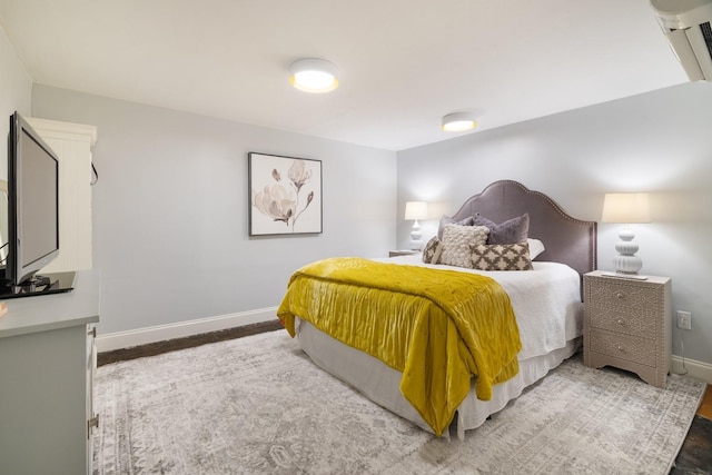 bedroom with wood-type flooring