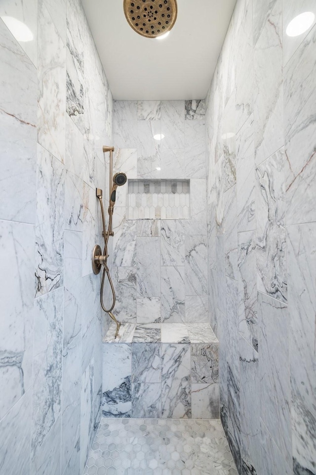 bathroom with tiled shower