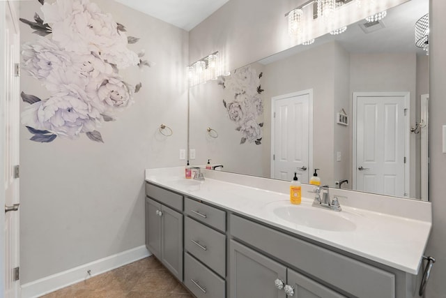 bathroom with tile patterned floors and vanity