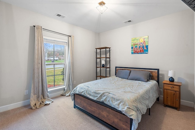 carpeted bedroom with multiple windows