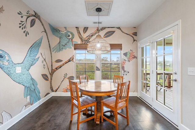 dining room with dark hardwood / wood-style flooring