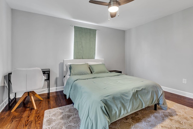 bedroom with hardwood / wood-style floors and ceiling fan