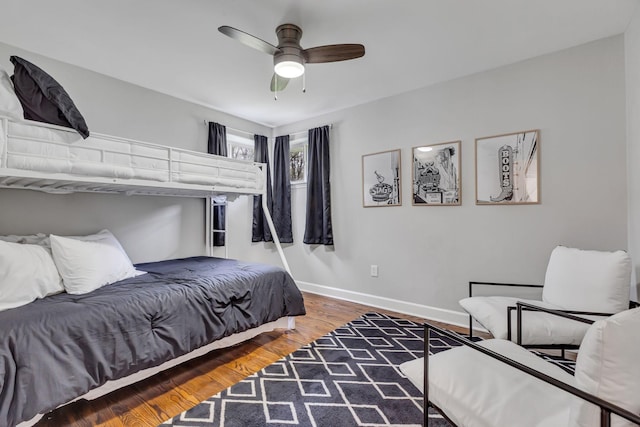 bedroom with hardwood / wood-style floors and ceiling fan