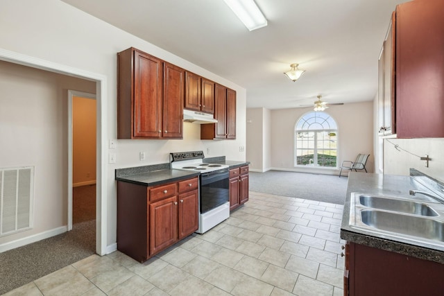 kitchen featuring light colored carpet, white electric stove, ceiling fan, and sink