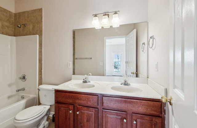 full bathroom with vanity, toilet, and bathtub / shower combination