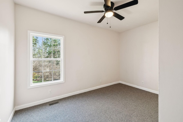 carpeted empty room with ceiling fan