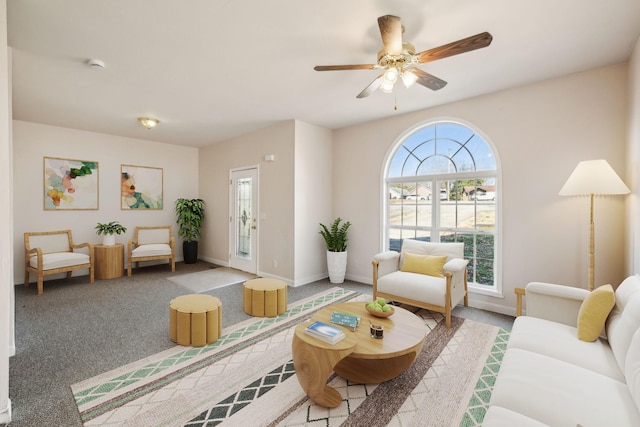 living room featuring carpet flooring and ceiling fan