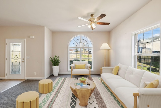 living room featuring carpet flooring and ceiling fan