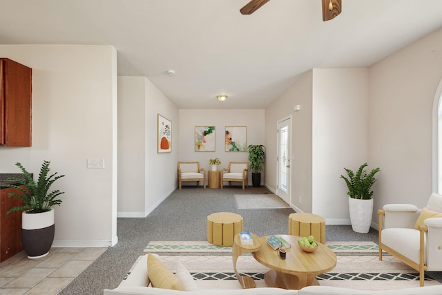 living room with ceiling fan and light colored carpet