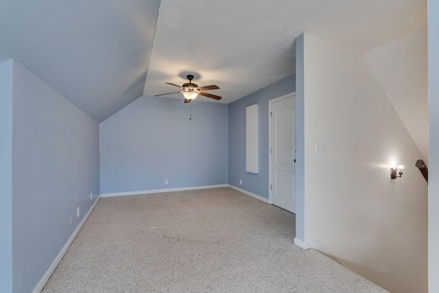 bonus room featuring ceiling fan, carpet floors, and lofted ceiling