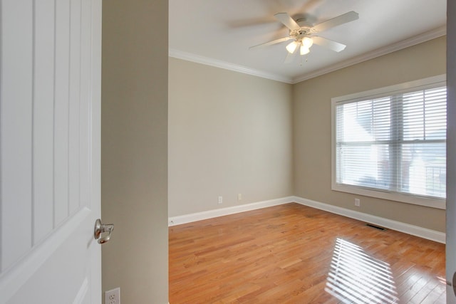 spare room with ceiling fan, light hardwood / wood-style floors, and ornamental molding