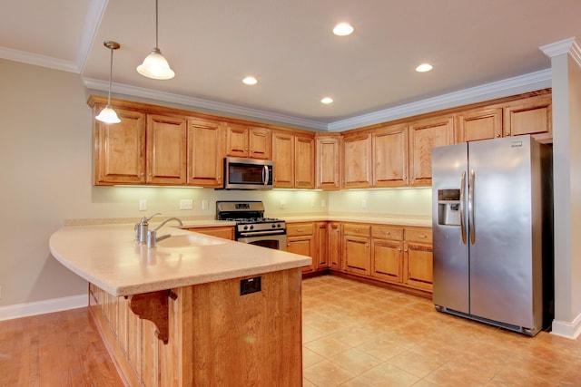 kitchen with sink, kitchen peninsula, crown molding, pendant lighting, and appliances with stainless steel finishes