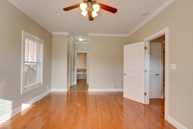 unfurnished room featuring light hardwood / wood-style floors, ceiling fan, and ornamental molding