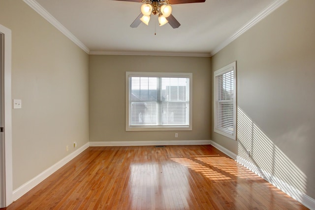 empty room with ceiling fan, light wood-type flooring, and ornamental molding