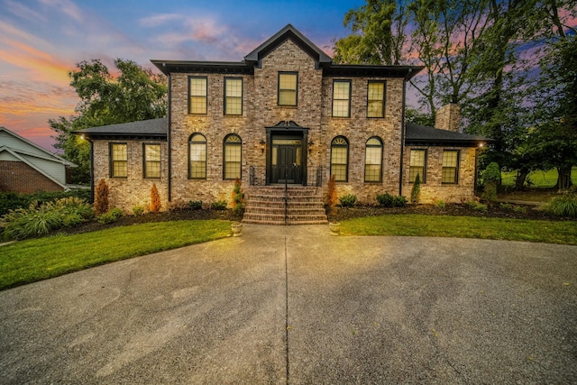 colonial house with a yard