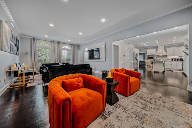 living room with wood-type flooring and ornamental molding