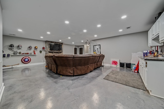 living room featuring concrete floors