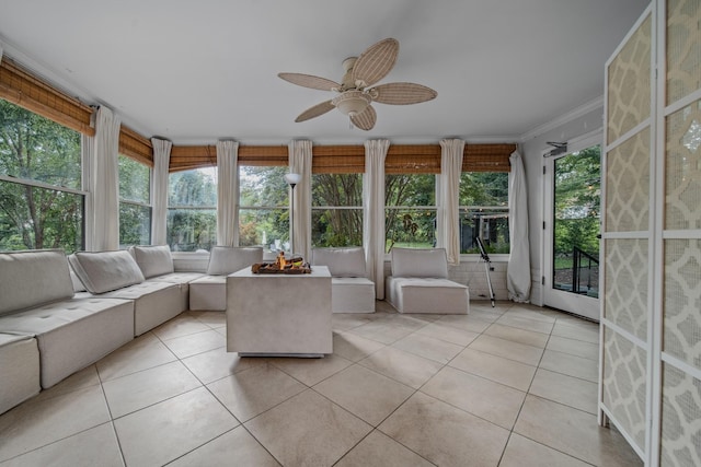 unfurnished sunroom with ceiling fan