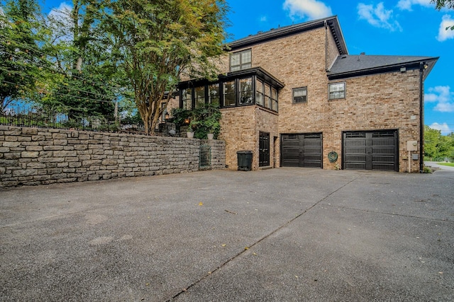 view of side of property featuring a garage