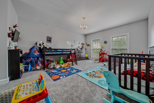 bedroom with carpet flooring and a chandelier