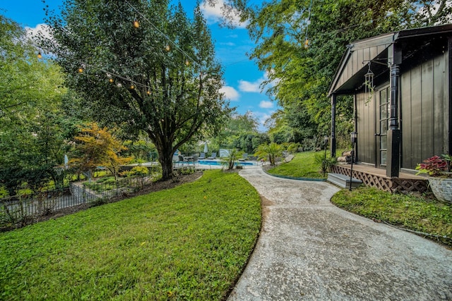 view of yard featuring a fenced in pool