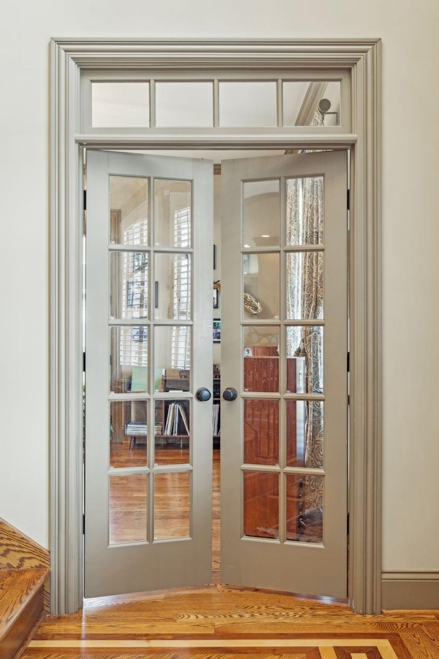 entryway featuring french doors and hardwood / wood-style floors