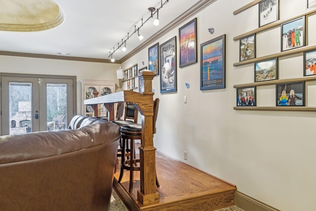 living room with french doors and ornamental molding