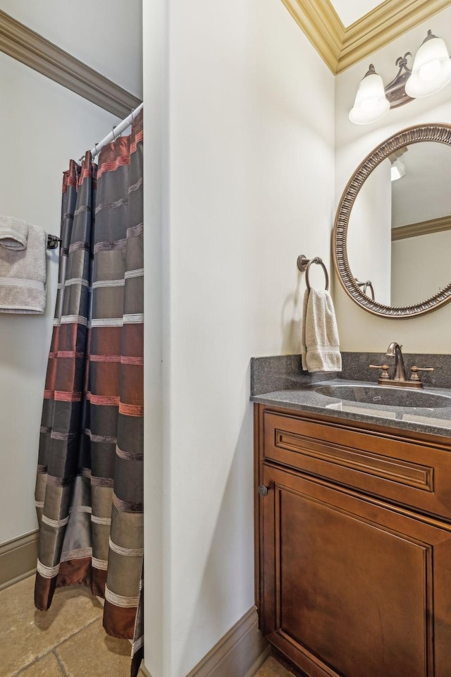 bathroom with vanity and ornamental molding