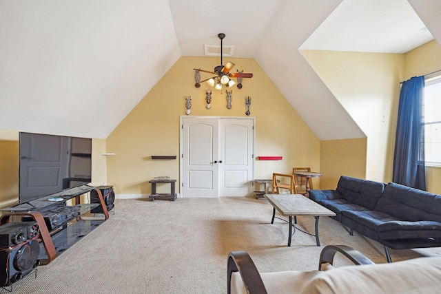 carpeted living room featuring ceiling fan and lofted ceiling