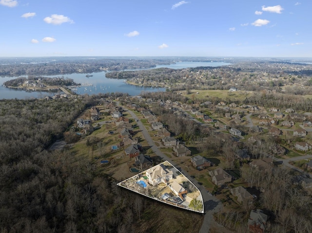 birds eye view of property featuring a water view