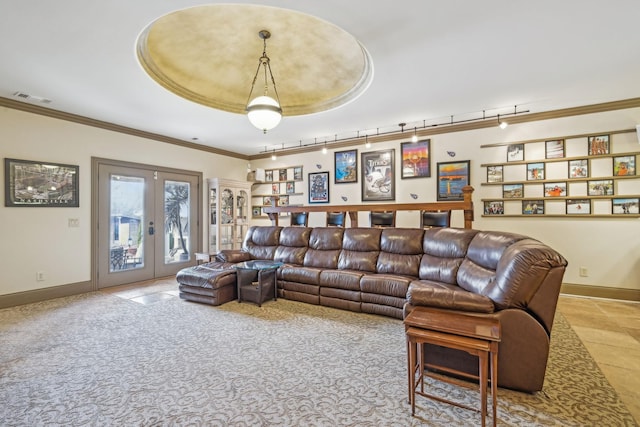 living room featuring a raised ceiling, french doors, light colored carpet, and ornamental molding