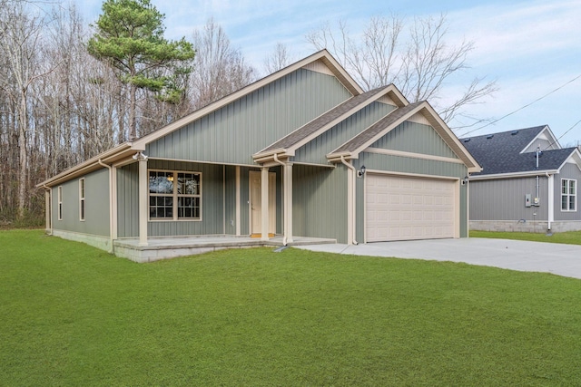 view of front of property with a front yard, a porch, and a garage