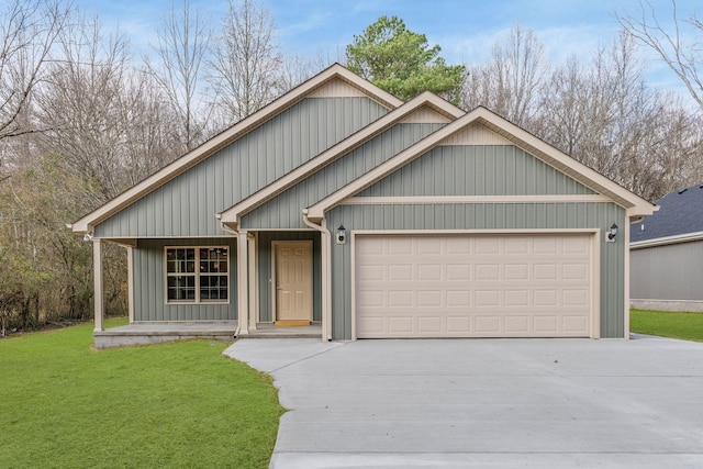 view of front facade with covered porch, a garage, and a front lawn