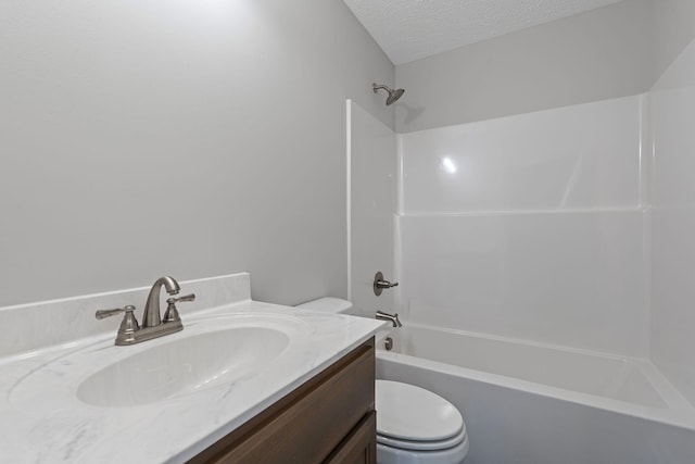 full bathroom with vanity, toilet, shower / tub combination, and a textured ceiling