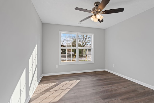 spare room with ceiling fan and hardwood / wood-style flooring