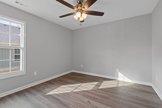 spare room featuring hardwood / wood-style floors and ceiling fan