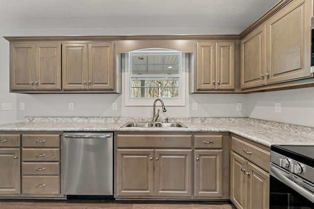 kitchen with appliances with stainless steel finishes, a textured ceiling, and sink