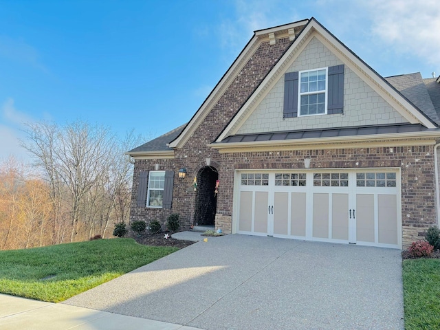 craftsman-style home with a front yard and a garage