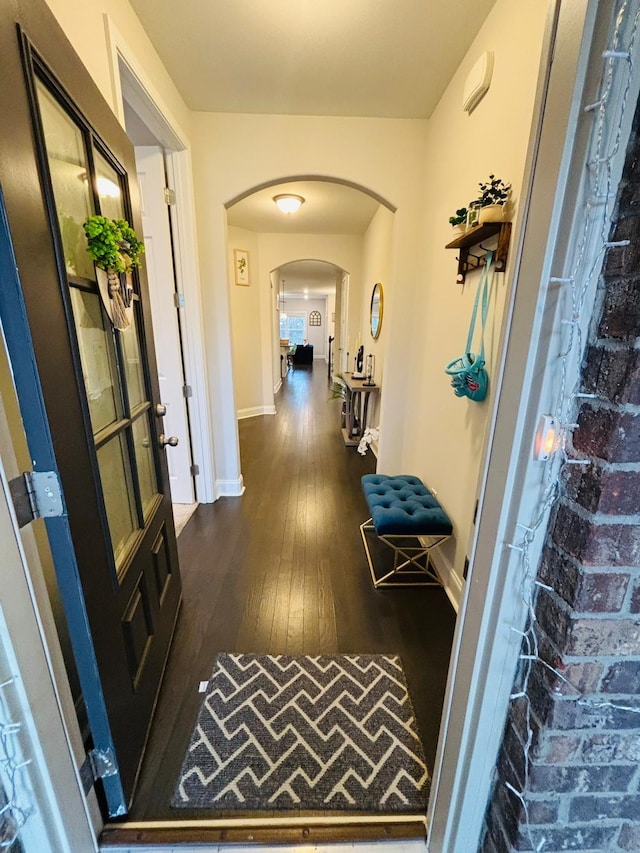 hall featuring dark wood-type flooring