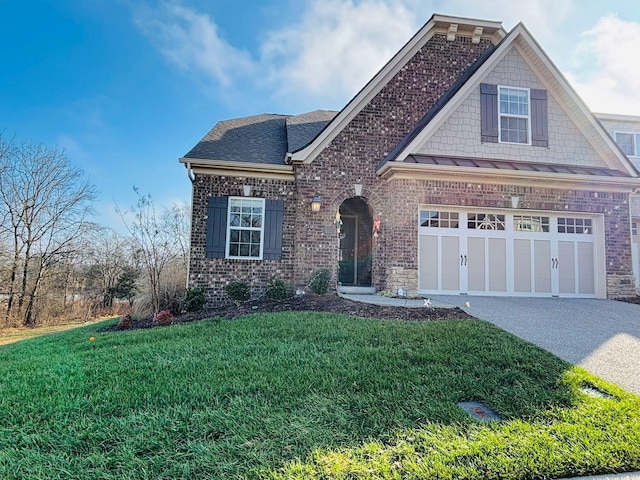 view of front of home featuring a front lawn and a garage